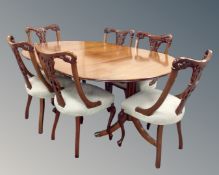 A Victorian style twin pedestal D-end dining table with leaf together with a set of seven dining