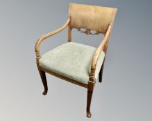 A Continental oak open armchair