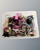 A box containing a large quantity of costume jewellery, beads, bangles etc.