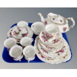 A tray of Hammersley rose pattern tea china.