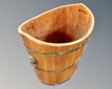 A mahogany brass bound log bucket.