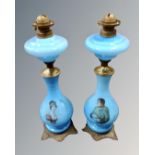 A pair of Victorian blue glass transfer printed lamp bases.