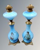 A pair of Victorian blue glass transfer printed lamp bases.