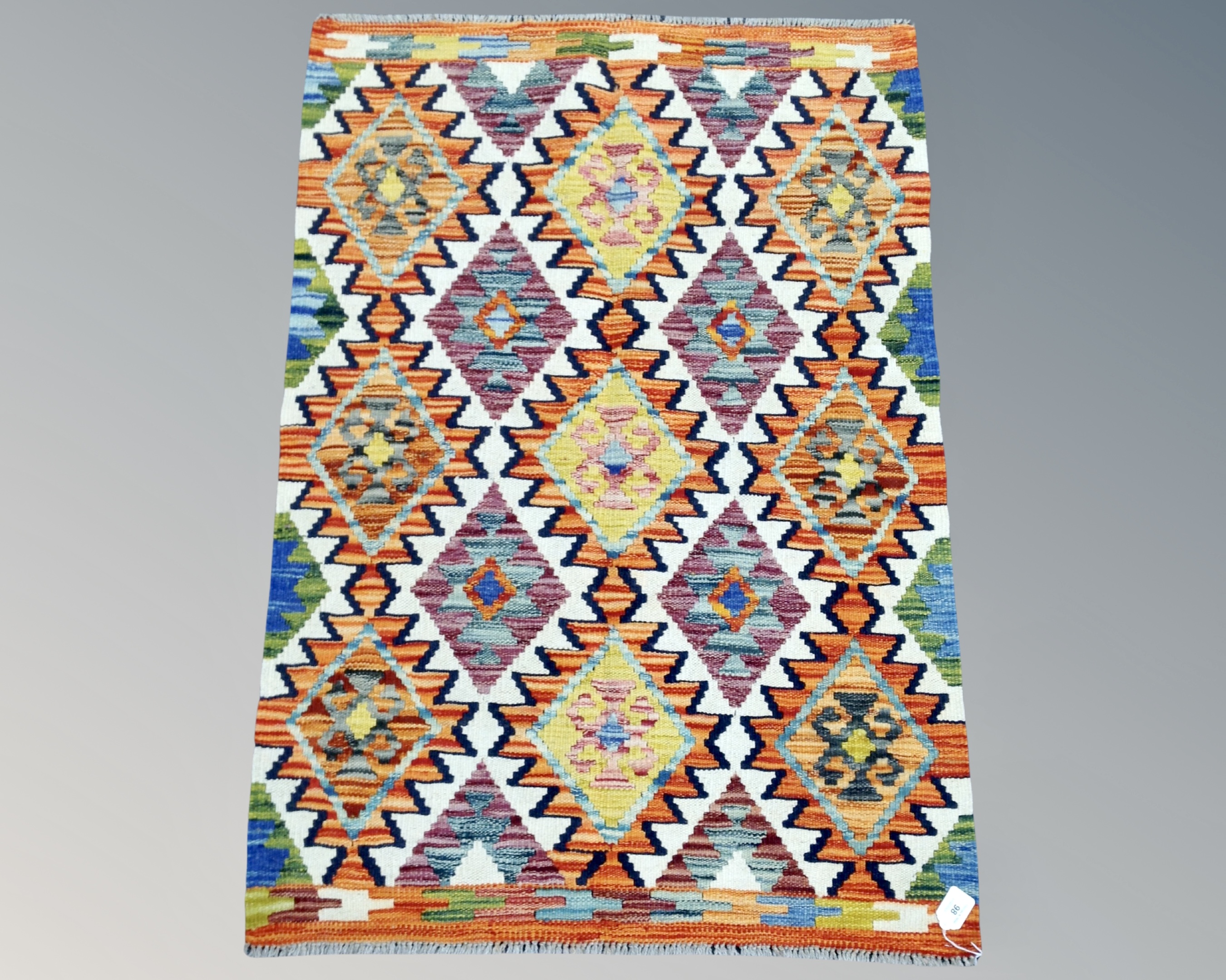 A Chobi Kilim rug, 116cm by 81cm.