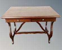 A mahogany veneered two drawer hall table.