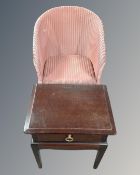 A 20th century Lusty Lloyd Loom armchair together with Stag Minstrel bedside table