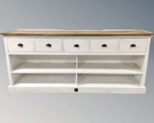 A Riviera Maison farmhouse kitchen unit on painted base fitted with shelves