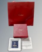A Cartier plane motif porcelain trinket tray in box and retail bag.