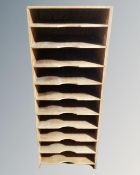 A 20th century plywood ten docket shelf