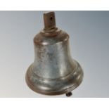 A large antique brass bell.