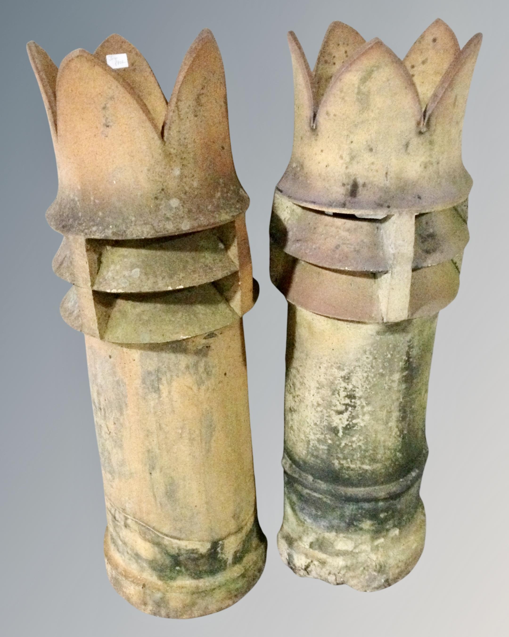 A pair of Victorian crown chimney pots