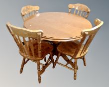 An American Colonial style pedestal dining table with four chairs