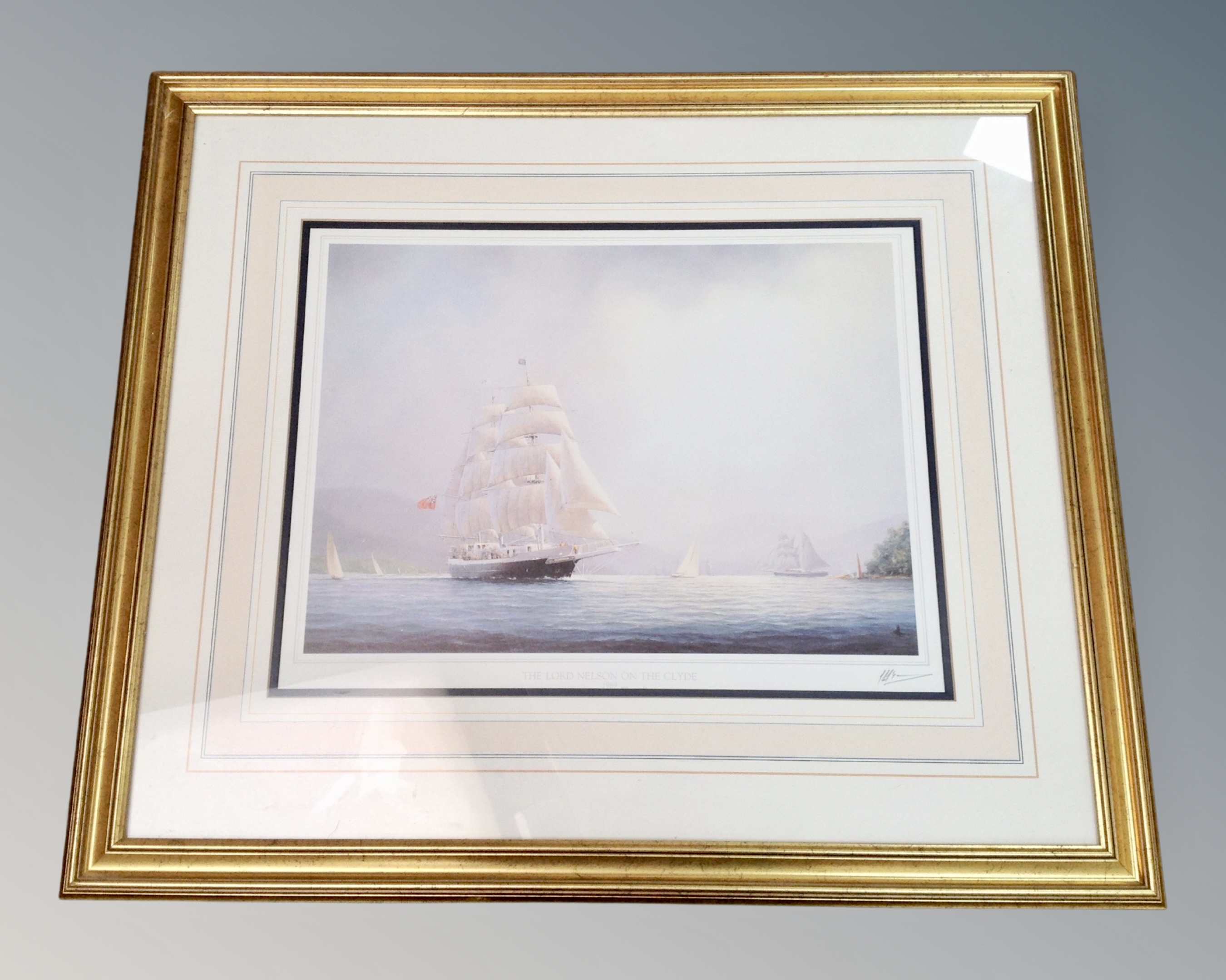 A gilt framed print after Thompson : The Lord Nelson on the Clyde, 1989, signed in pencil.