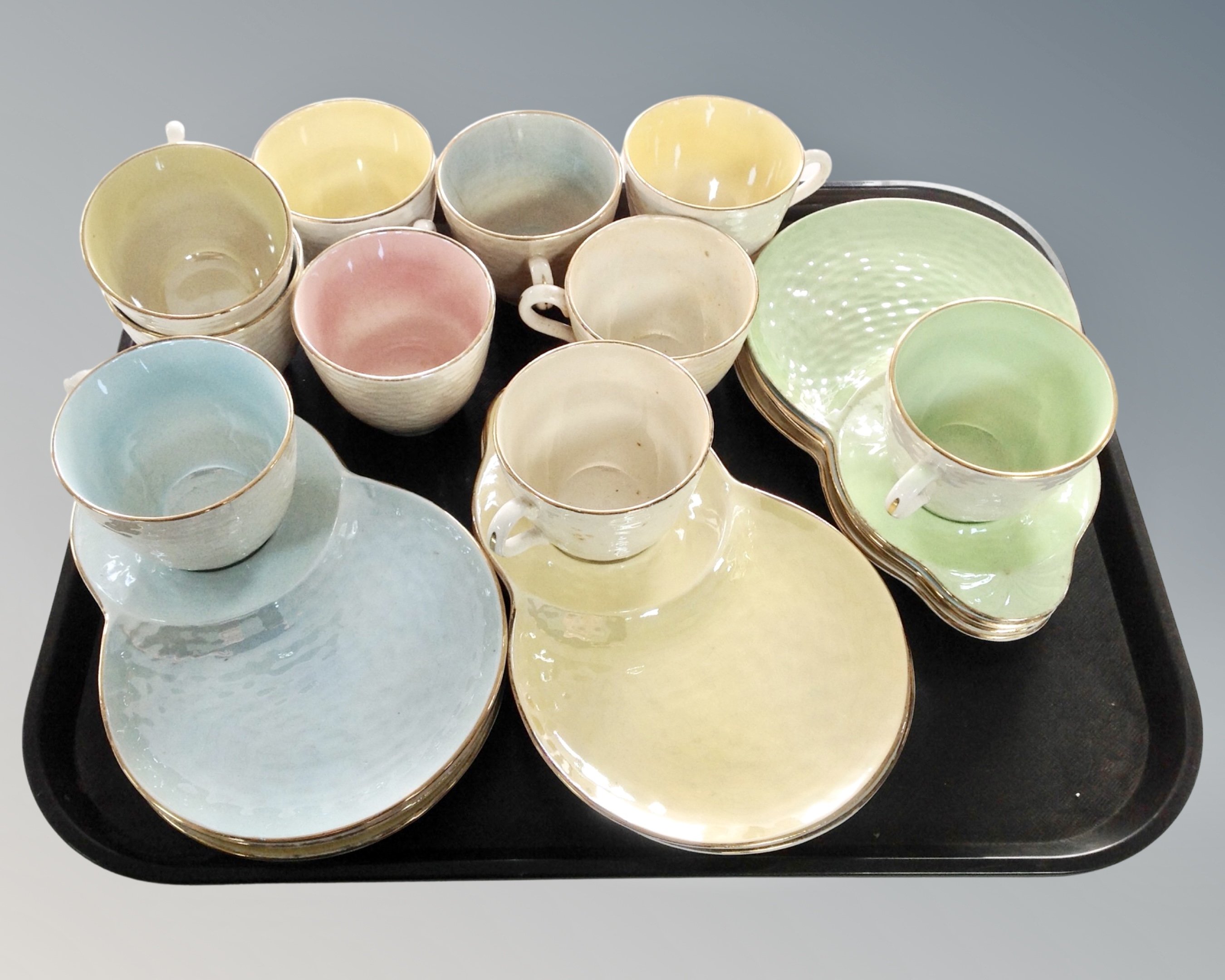 A tray of Maling lustre ware, sandwich cups and saucers.