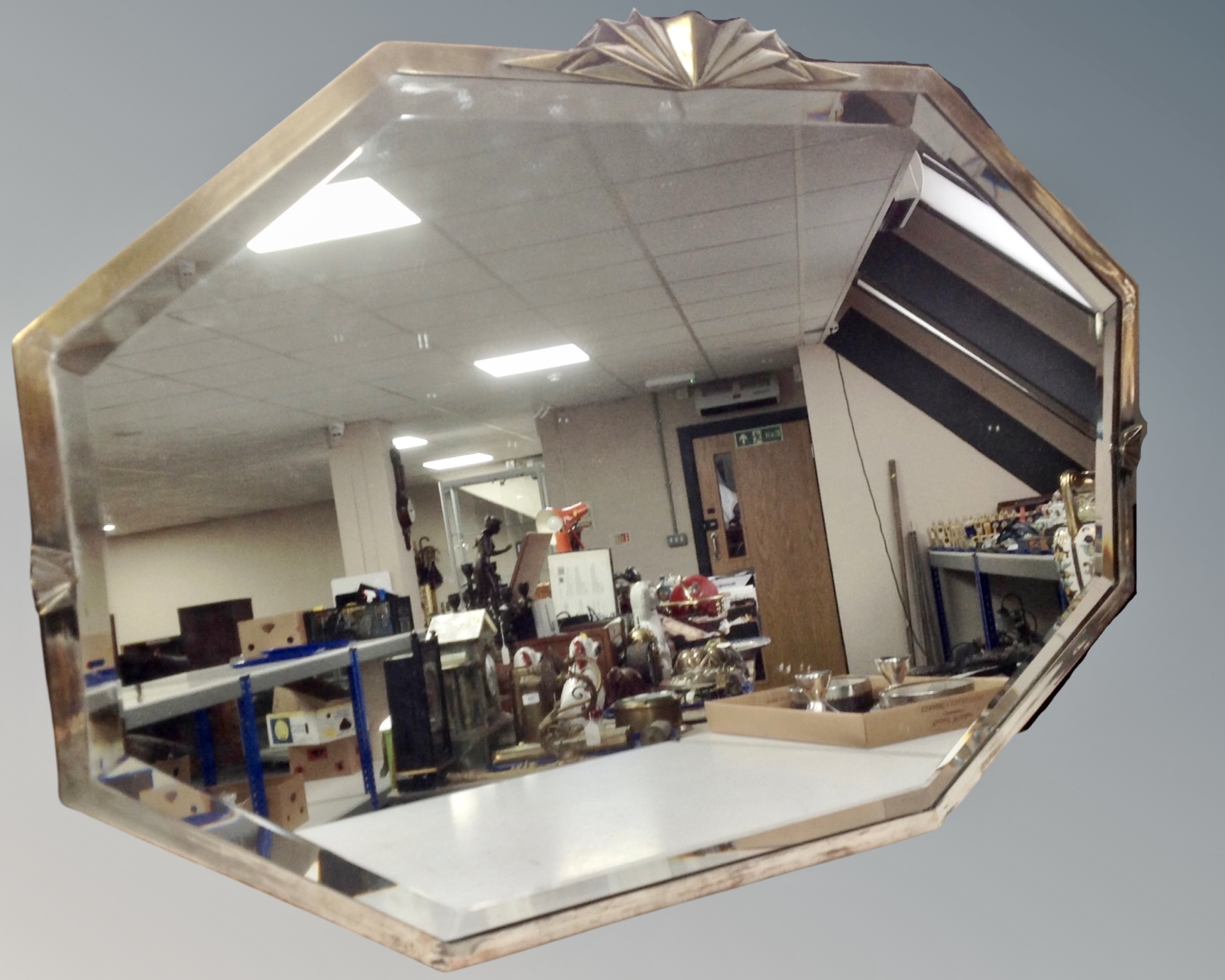 An early 20th century Art Deco style bevelled mirror.