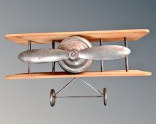 A contemporary wall shelf in the form of a biplane