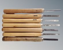 Seven wood turning chisels.