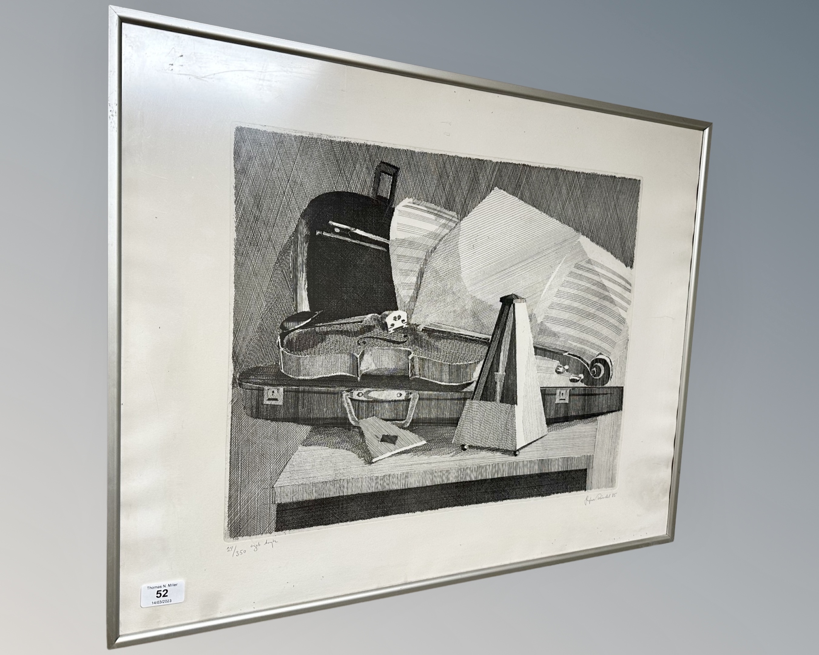 A continental monochrome print depicting a violin with metronome, indistinctly signed, 70cm by 56cm.