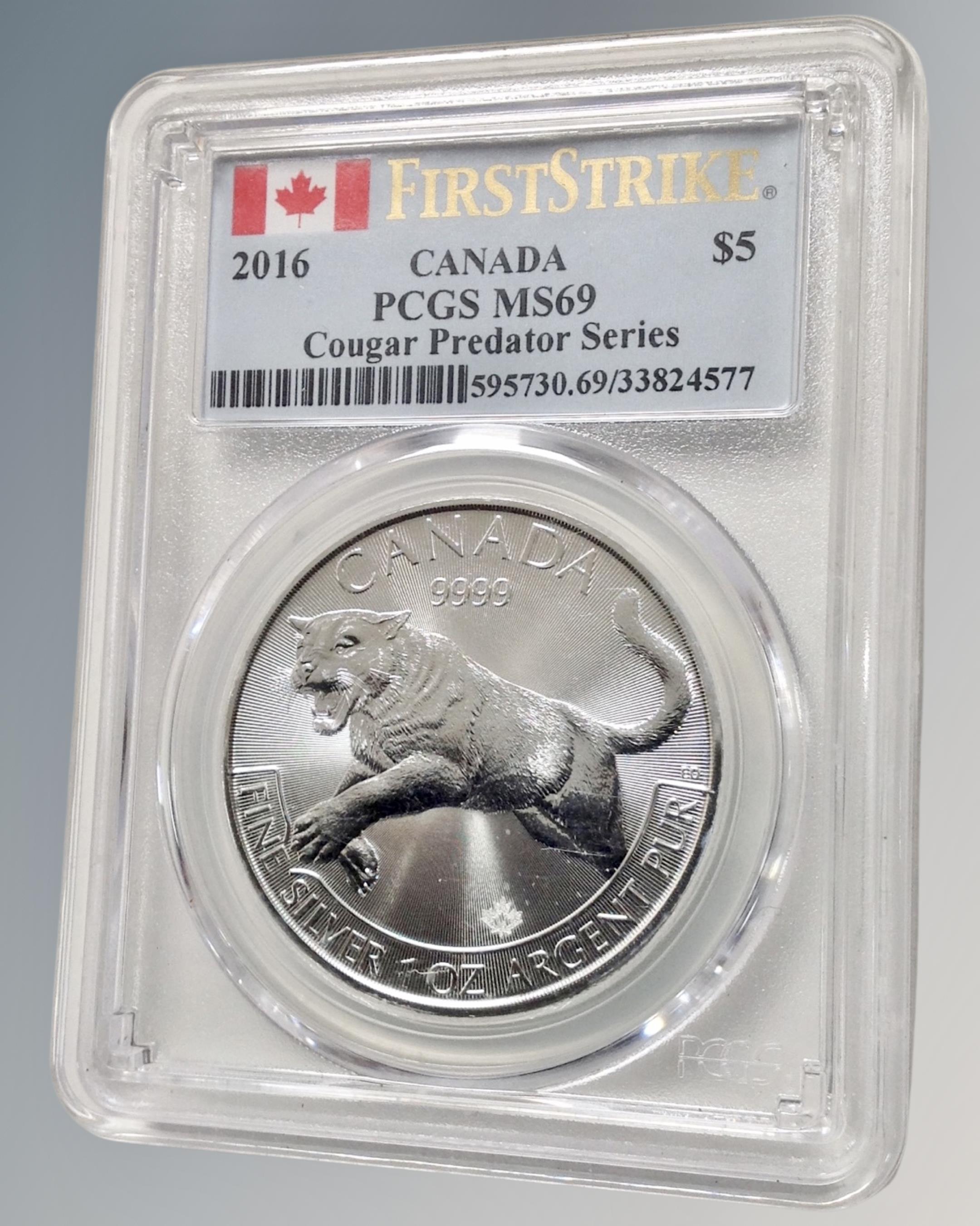 A 2016 Canadian $5 First Strike Cougar Predator Series 1oz fine silver coin.