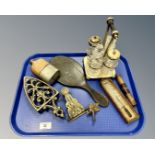 A hip flask, a plated cruet, a thermometer, hand mirror, brass trivet,