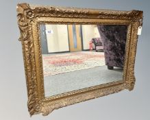 An antique gilt framed mirror, 80cm by 62cm.