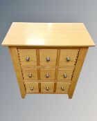 A contemporary oak three drawer chest