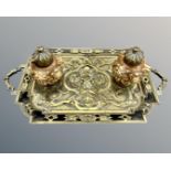 A Victorian cast brass and ceramic desk stand with two inkwells, width 37cm.