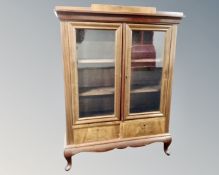 A continental mahogany double door glazed bookcase (width 102cm)