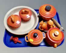 A tray containing a Le Creuset cast iron lidded pan, ceramic pots, two Bella Cuisina dishes,