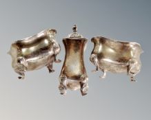 A three piece silver cruet set.