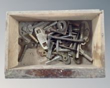 A wooden box containing clock keys.