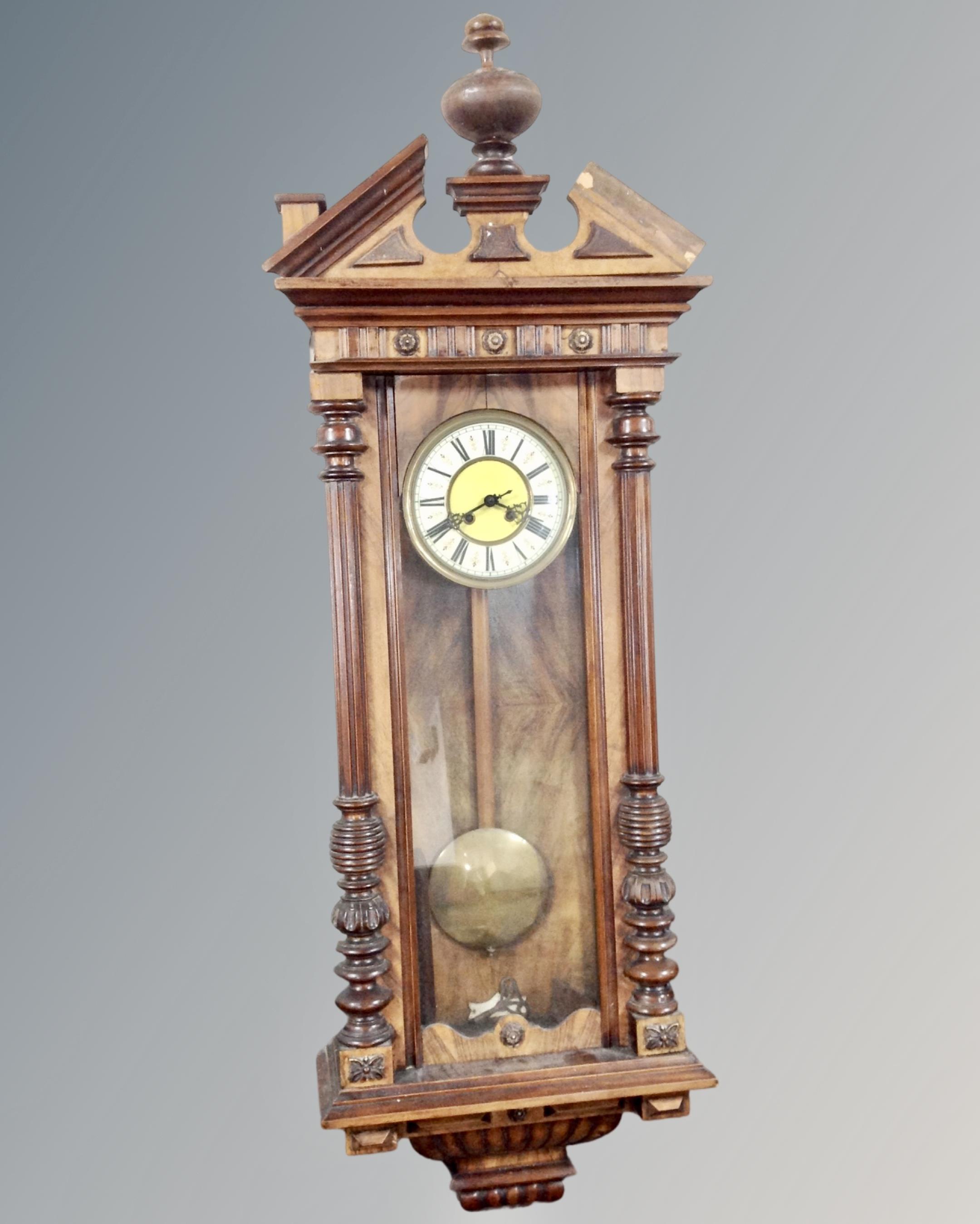 A 19th century Vienna style eight day wall clock with pendulum