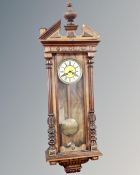 A 19th century Vienna style eight day wall clock with pendulum