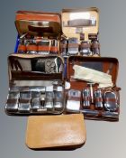 A collection of mid-20th century gentleman's travelling vanity sets.