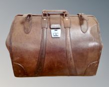 A vintage stitched brown leather Gladstone bag.