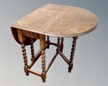 An Edwardian oak barley twist gateleg table