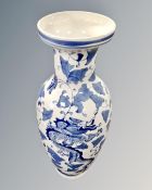 A large blue and white Chinese style vase.