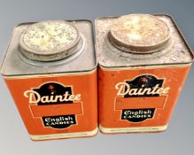 A vintage pair of English metal tins with Daintee advertisement decoration.