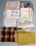 A quantity of blankets and quilted covers