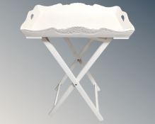 A butler's table on folding stand