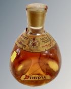 A bottle John Haig dimple whisky.