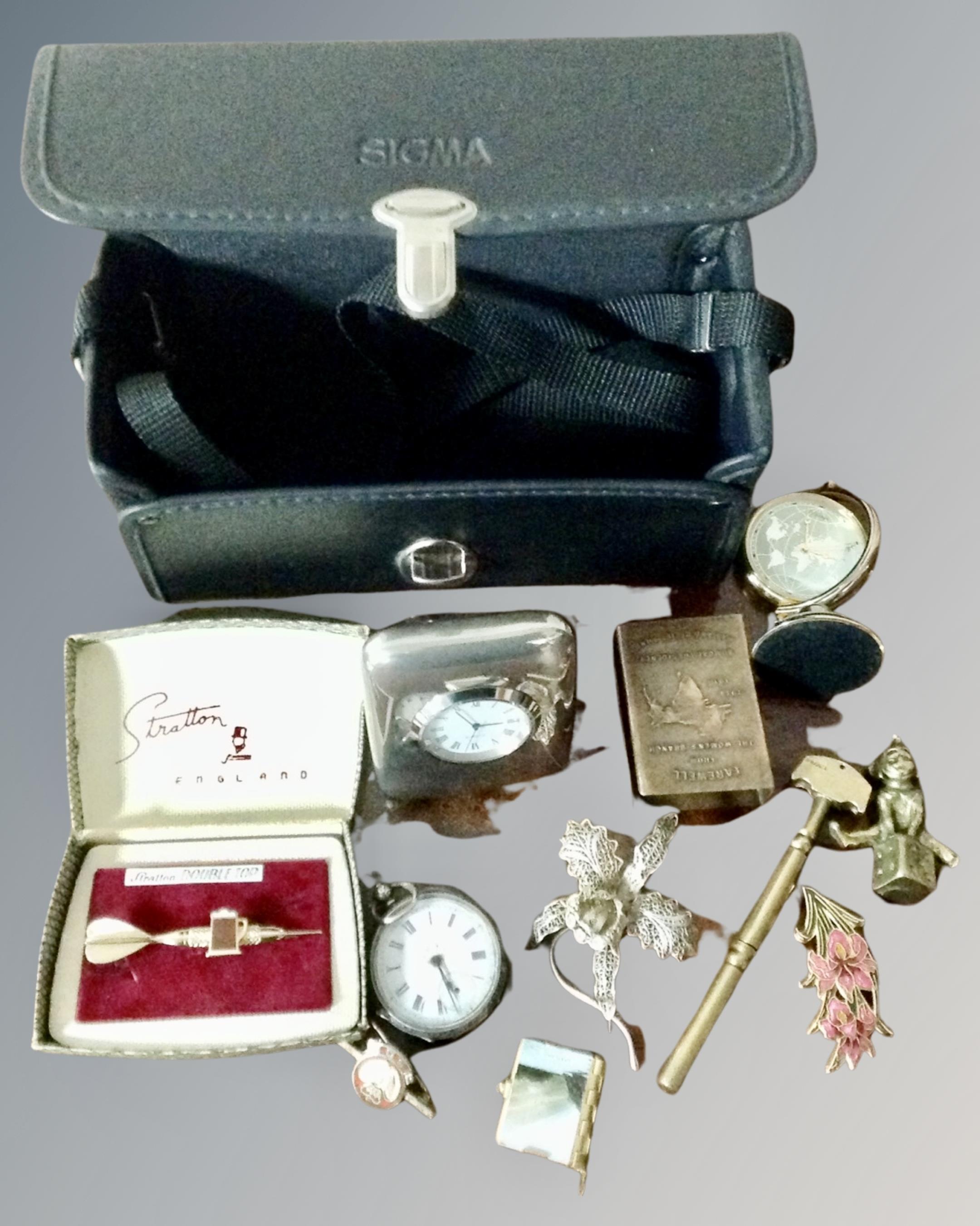 A box containing a desk clock, vesta case, continental fob watch etc.