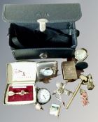 A box containing a desk clock, vesta case, continental fob watch etc.