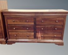 A Willis and Gambier cherry wood eight drawer block chest