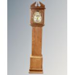 An oak Tempus Fugit longcase clock