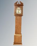 An oak Tempus Fugit longcase clock