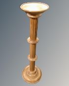 A reproduction torchere