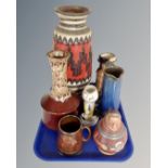 A tray containing a large West German pottery vase, Martell figure jug,