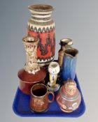 A tray containing a large West German pottery vase, Martell figure jug,