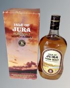 A bottle of Isle of Jura pure malt scotch whisky, eight years old, in box.